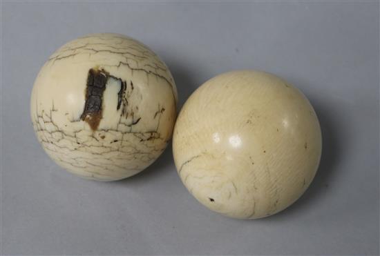 2 ivory billiard balls